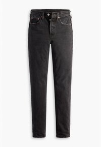 Jeans negros ajustados con cinco bolsillos, cierre de botón y sutiles detalles de costura, exhibidos sobre un fondo blanco.