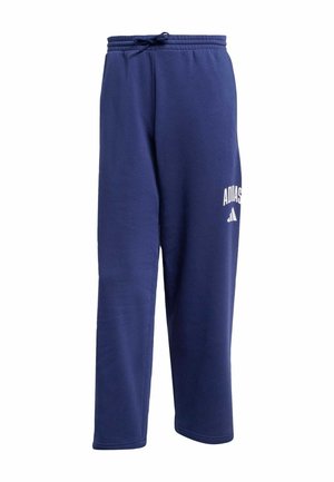 Pantalon de survêtement bleu marine en matériau doux, doté d'une taille élastique avec cordon de serrage et d'un logo Adidas blanc sur la jambe gauche.