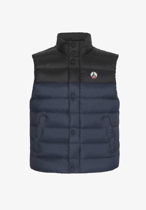 Chaleco acolchado sin mangas con sección superior negra, sección inferior azul marino, botones a presión delanteros, bolsillos laterales y logotipo circular en el pecho.
