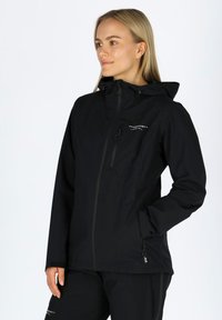 Black waterproof jacket with a hood, zippered front, and side pockets. Features a smooth texture and adjustable drawstring for a fitted look.