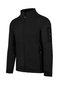 Schwarze Zip-Jacke mit hohem Kragen, aus strukturiertem Stoff, mit seitlichen Zippertaschen und einer kleinen Zippertasche am oberen Arm.