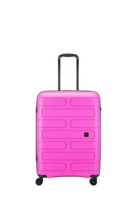 Pink hard-shell suitcase with textured surface, a retractable handle, and four black wheels. Features horizontal grooves and a smooth finish.