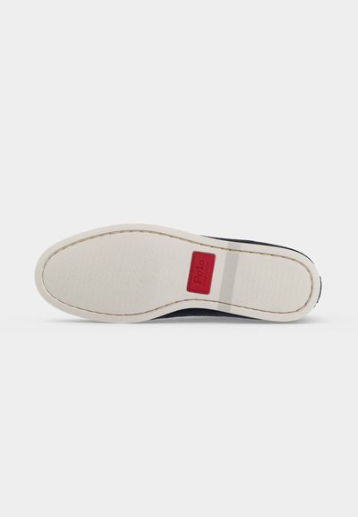 Shoe sole in off-white with stitching detail, featuring a red rectangular logo patch labeled "Polo" near the heel.