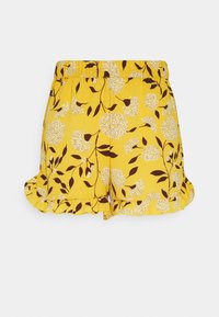 Geel shorts met bloemenpatroon met witte en bruine bloemen. Elastische taille, rimpels aan de onderrand en lichtgewicht stof.