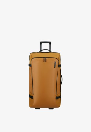 Tall rectangular orange suitcase with black telescopic handle, side handle, front zipper pocket, and black compression straps.