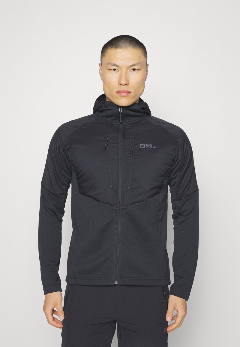 Black hooded jacket with zippered pockets, textured upper panel, and smooth lower section, featuring a logo on the left chest area.