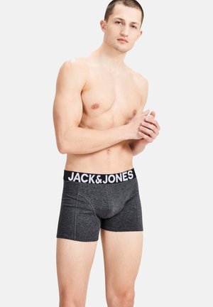 Graue Boxershorts aus weichem Stoff mit schwarzem elastischem Bund, auf dem das "JACK & JONES"-Logo in Weiß aufgedruckt ist. Einfaches Design, enganliegende Form.