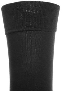 Calzino nero alla caviglia con una texture liscia e un bordo a coste. Il materiale appare elastico e morbido, progettato per il comfort e una calzata sicura.