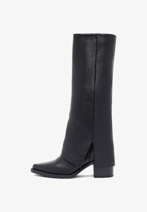 Black knee-high boot made of smooth leather with a square toe, block heel, and a slit detail along the outer side for design.