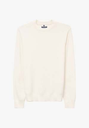 Sweatshirt couleur crème en tissu texturé, avec un col rond et des manches longues dotées de poignets et d'un ourlet côtelés. Design minimaliste.