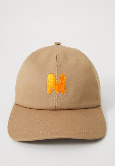 Tan baseball cap made of cotton with a structured design. Features an orange embroidered "M" on the front. Flat elongated brim.