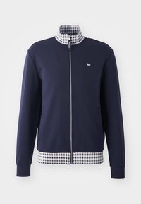 Navy zip-up jacket with a high collar, white and blue checkered inner lining, and checkered hem. Features side pockets and elastic cuffs.