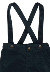 Pantaloni di velluto a coste neri con bretelle incrociate e tre bottoni marroni in vita, mostrati frontalmente su uno sfondo bianco.