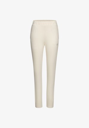 Cremefarbene Hose aus weichem Stoff, mit einem elastischen Bund und einer eng zulaufenden Form. Keine sichtbaren Muster oder Verzierungen.