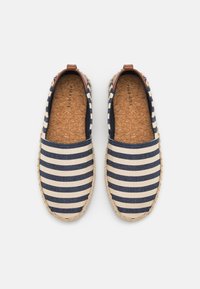 Striped slip-on shoes with dark blue and cream colors, made of canvas with a woven jute sole and brown leather accents on the heel.