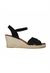 Black suede wedge sandals with crossed straps, jute-wrapped midsole, and ankle strap. Textured surface with a brown insole.