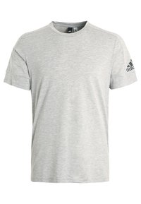 T-shirt grigia a maniche corte realizzata in tessuto morbido, con scollo rotondo e dettaglio logo nero sulla spalla sinistra.