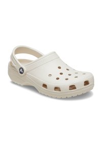 White closed-toe clog made from lightweight foam material, featuring ventilation holes, a heel strap, and a textured sole.