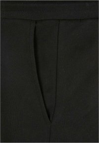 Urban Classics Donji dijelovi trenirke - black