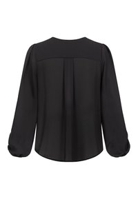 Blusa negra con mangas largas abullonadas. Tejido liso, escote redondo, con detalle de pliegue en la parte trasera y bajo curvado.