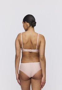 Pink lace bra with adjustable straps and a hook closure, paired with matching bikini briefs featuring a textured checkered pattern.