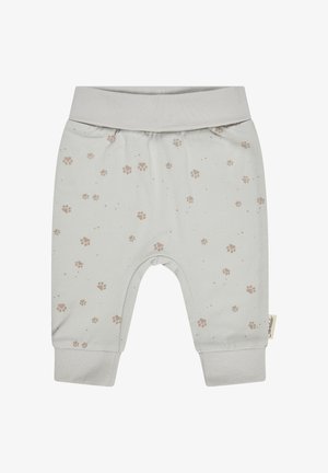 Hellgraue Babyhose mit braunen Pfotenabdrücken, breitem elastischem Bund und enganliegenden Bündchen an den Knöcheln.