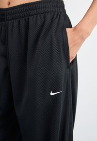 Nike Sportswear PANT COORD - Donji dijelovi trenirke - black