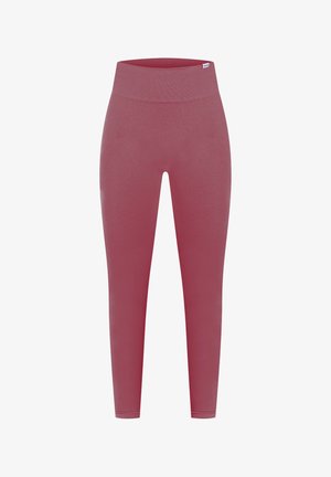 Leggings de cintura alta en un color rosa apagado, hechos de tejido elástico, con una textura suave y un diseño sin costuras.