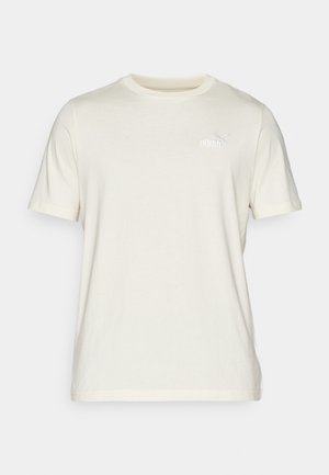 Kremowa koszulka z krótkim rękawem, wykonana z miękkiej bawełny, z okrągłym dekoltem. Posiada małe haftowane logo Puma na piersi.