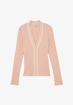 Lyserød ribbet cardigan med lange ærmer, dyb V-udskæring og hvid bølget kant langs udskæringen ned foran.