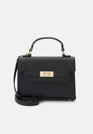 Black structured handbag made of textured synthetic material. Features a gold-tone clasp, detachable shoulder strap, and short top handle.