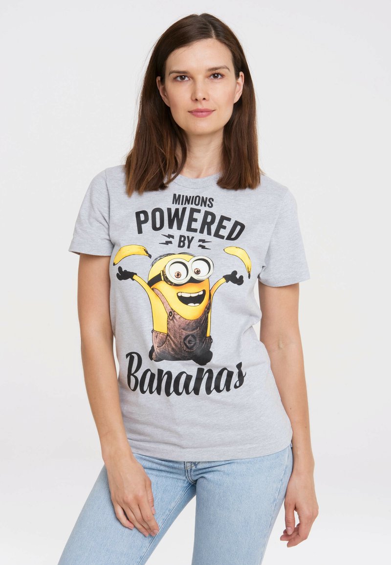Gray cotton t-shirt featuring a Minion character graphic with "Powered by Bananas" text, short sleeves, and a round neck.