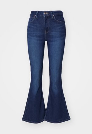 Mørkeblå utsvingte jeans laget av denim, med høy livhøyde, fem lommer og knappelukking, med en lett falming av fargen på lårene.