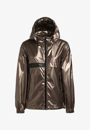 Metallik pronksist kapuutsiga jakk, millel on tõmblukk eespool, elastsed mansetid ja kontrastne must rinnanööp, millel on logo "Khujo". Sile, läikiv tekstuur.