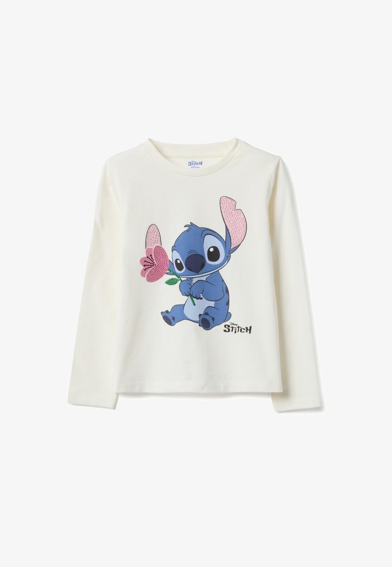 Cremefarbenes Langarmshirt mit einer blauen Comicfigur, die eine Blume hält, mit rosa Akzenten an den Ohren der Figur und einem aufgedruckten Logo.