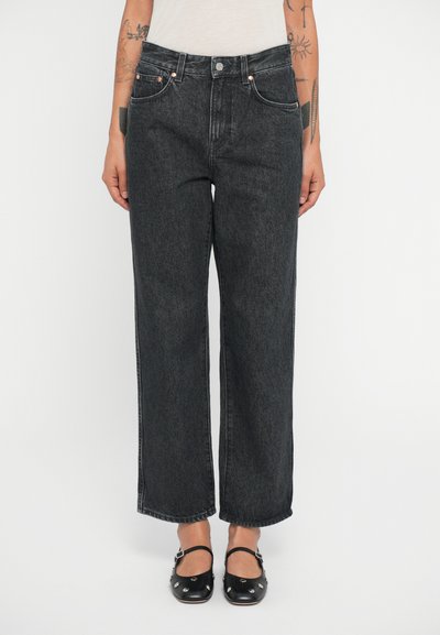 Wide-leg, dark gray denim jeans with a high waist, five-pocket design, and copper hardware accents. Smooth texture, cropped length.