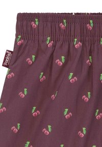 Shorts en tissu bourgogne avec un motif de cerises en rose et vert, dotés d'une taille smocks et d'une petite étiquette de marque.