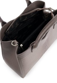 Taupe textured leather handbag with dual handles, open top zipper, and black interior lining with zippered inner pocket.