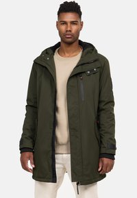 Olive green waterproof parka with a hood, front zip, and snap buttons. Features multiple pockets and elasticized cuffs for a secure fit.