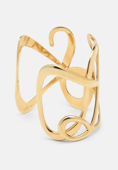 Aukso apyrankė, su sklandžiais, susipynusiais formomis. Lygus paviršius ir atviras dizainas, turintis įvairius storio ir kreivių pokyčius.