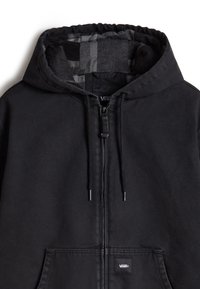 Felpa nera con zip e interno a quadri. Presenta lacci sul cappuccio, tasche frontali e patch del logo Vans nella parte inferiore della tasca.