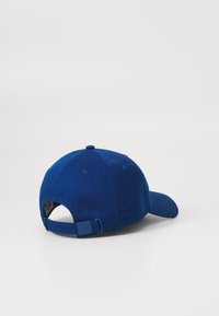 Lacoste Sapka - globe