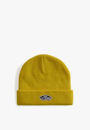 Żółta dzianinowa czapka z podwiniętym mankietem z małą czarno-białą naszywką z logo Vans "Off The Wall" z przodu.