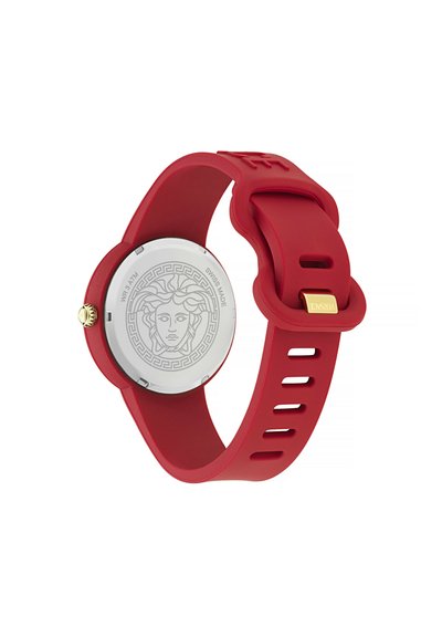 Red silicone watch with a round face, featuring a Medusa design on a silver background, gold crown, and a textured strap with cutouts.