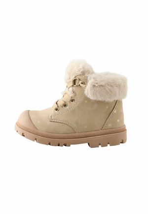 Botte d'hiver beige pour enfants avec doublure en fourrure, laçage à l'avant, motif étoile et semelle en caoutchouc robuste pour une utilisation extérieure.