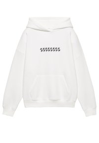 Fehér kapucnis pulóver elülső kenguruzsebbel, húzózsinóros kapucnival, és fekete csillagok mintájával a mellkason. Puha, texturált pamut anyagból.