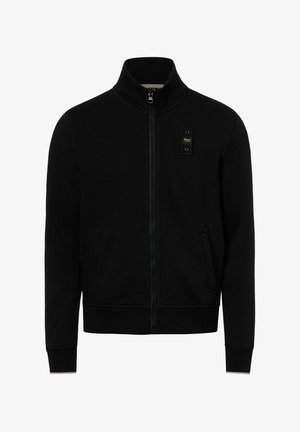 Black zip-up jacket with high collar, two front pockets, and a small rectangular patch with yellow text on the left chest.