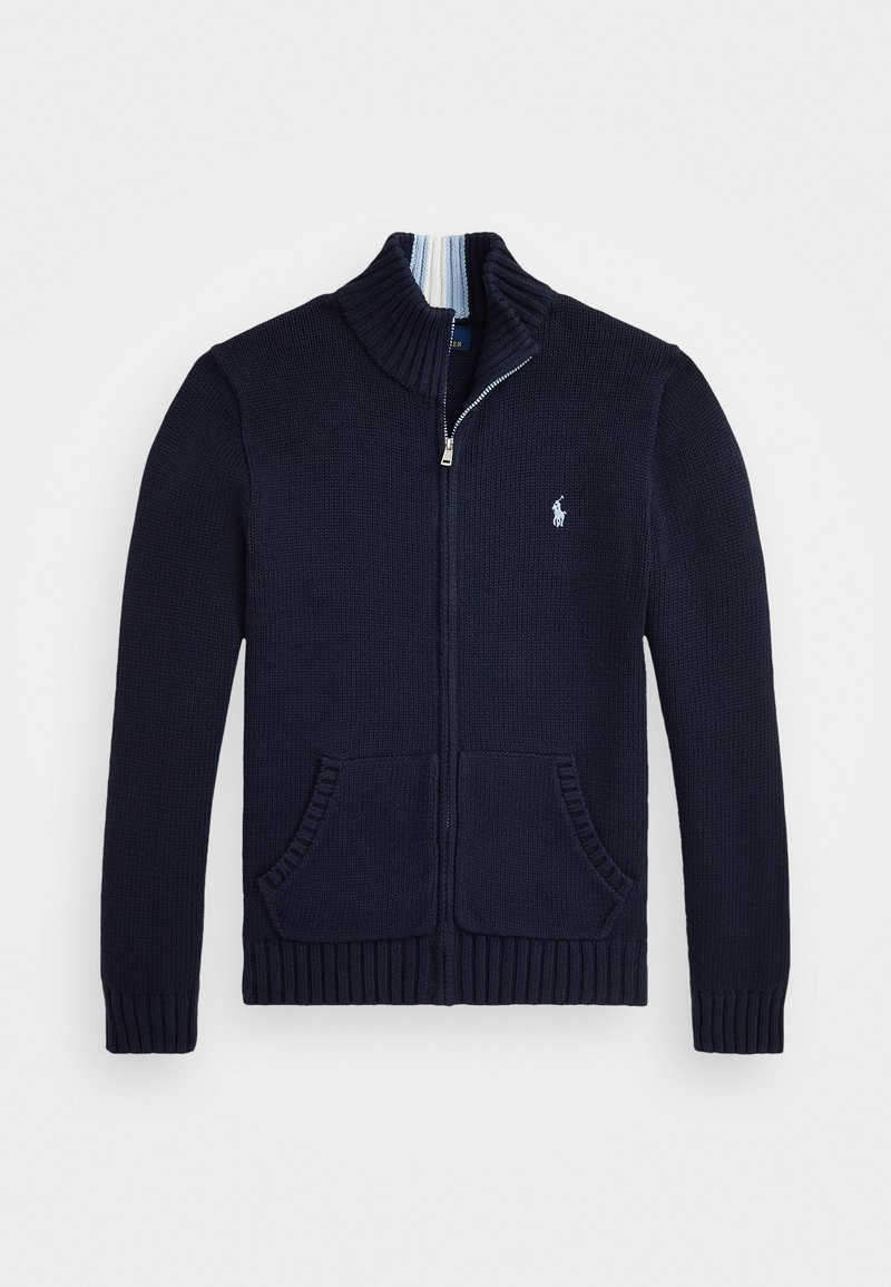 Marineblauer Pullover mit hohem Kragen, voller Reißverschluss, Rippbund und zwei Fronttaschen. Mit einem kleinen gestickten Logo auf der Brust.