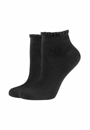 Schwarze Knöchelsocken mit geripptem Design, die über einen gewellten Saum und einen enganliegenden Sitz verfügen. Hergestellt aus atmungsaktivem Material für zusätzlichen Komfort.