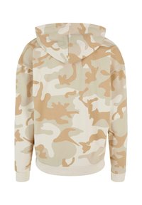 Beige camo hettegenser med en myk tekstur, med hette og lange ermer. Designet inkluderer varierende lyse og mørke beige abstrakte former.